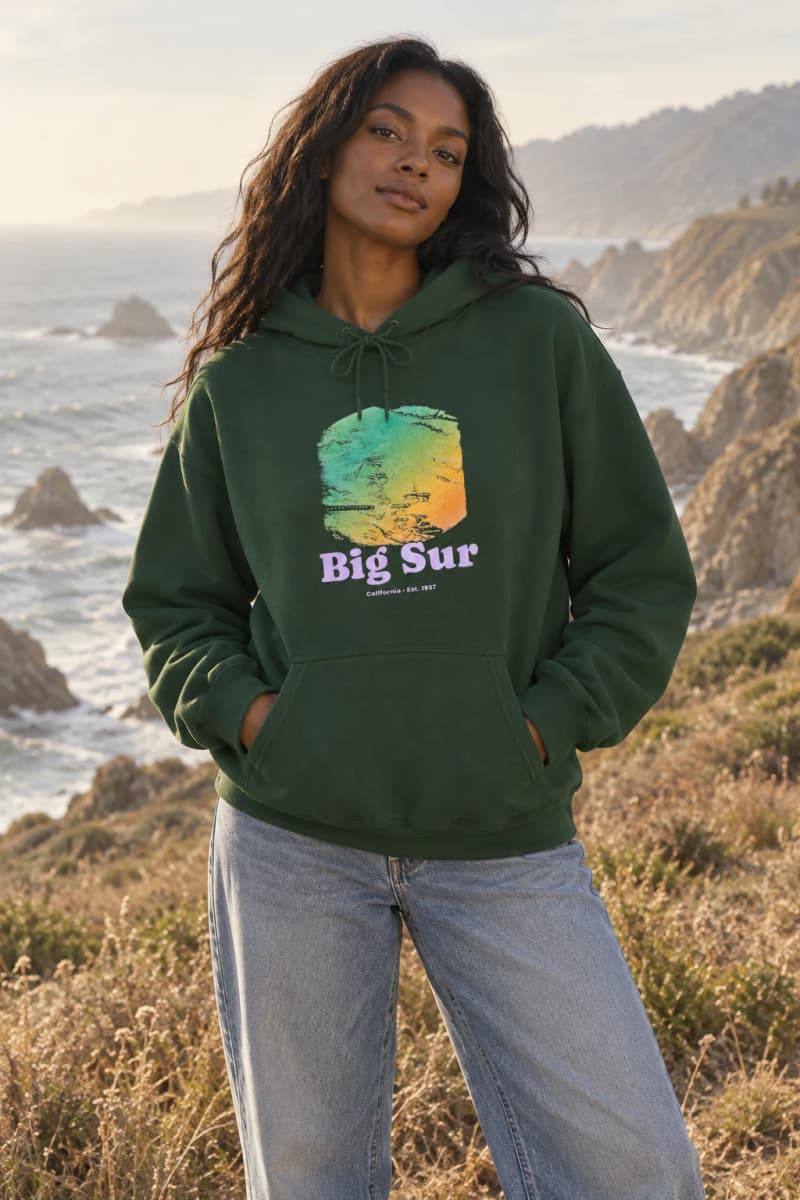 Model wearing the Big Sur Coast Map Hooded Sweatshirt in Forest Green